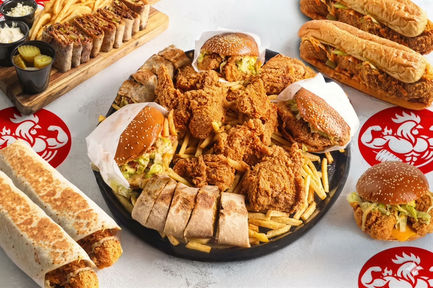 Mighty Halal fried chicken, sandwiches, wraps and fries arranged on a sharing platter